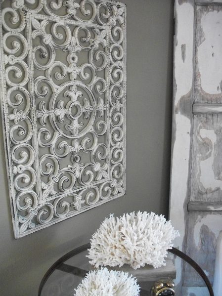 Turn a dollar store floor mat into faux wrought iron wall art - why didn't I think of that?