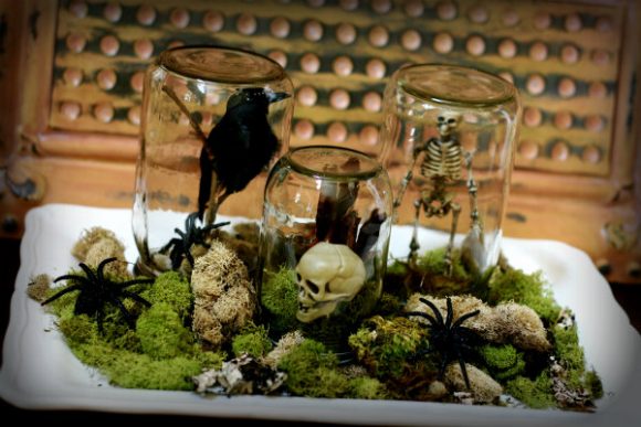 Make Halloween terrariums from recycled jars and dollar store halloween decorations