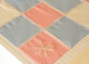 Make a paper napkin table runner (via dollarstorecrafts.com)
