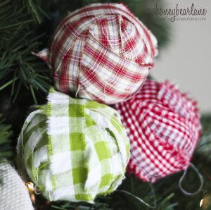 Make fabric-wrapped bulb Christmas ornaments (via dollarstorecrafts.com)