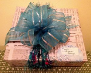 Gift embellished with ribbon and yarn