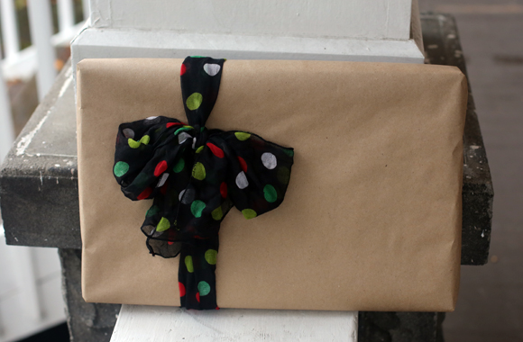 Wrap a dollar store scarf around kraft paper gift wrap