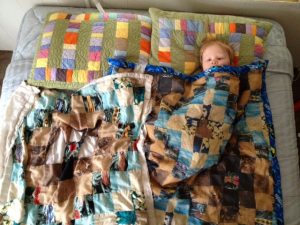 Take a picture of your child's old raggedy blanket and have it printed into fabric at Spoonflower so you can make them a new blanket!