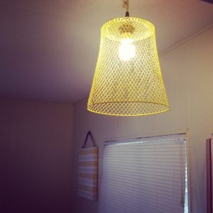 Make an industrial pendant lampshade from a dollar store wastebasket