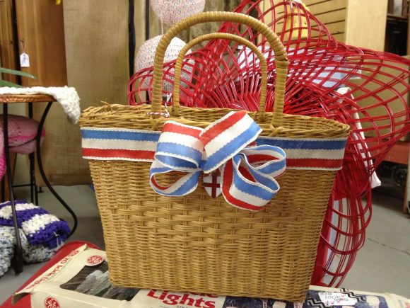 Cute way to embellish a basket - love that ribbon!