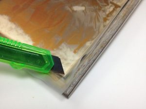 Trimming the transparent film for a faux daguerreotype - click for full instructions