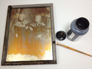 antiquing the frame to make it look old timey - click for full instructions