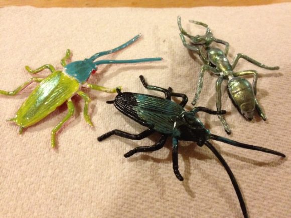 Painting dollar store bugs with nail polish