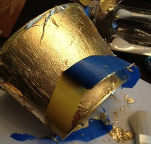 Remove masking tape from gold leafing project