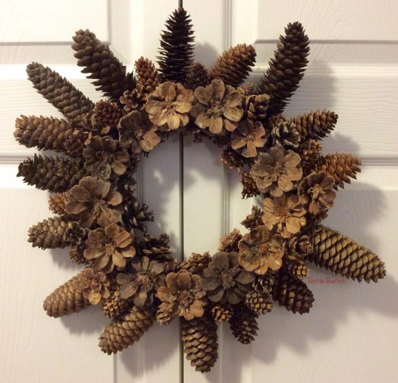 If you have access to pine cones and you own a hot glue gun, you can make this beautiful pine cone wreath for next to nothing.