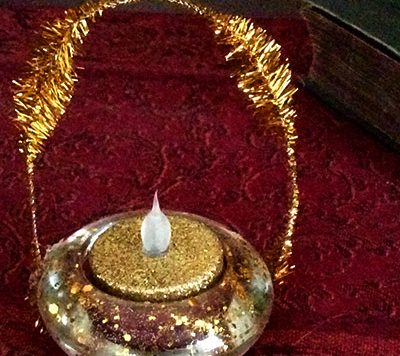 You can make this cute tea light Christmas ornament for as little as two dollars!