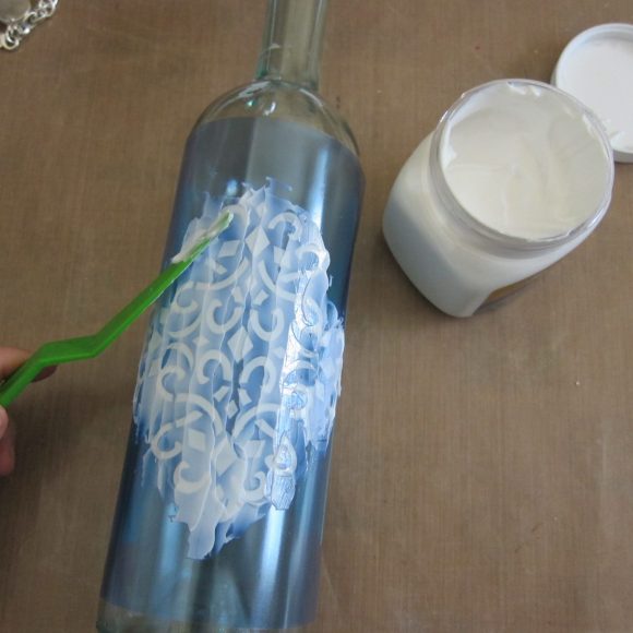 Make a Faux Sea Glass Bottle - Sea glass is still so popular, and it's a beautiful way to decorate your home in the summer.  Rather than buying new decorative accents, you can make your own using a few simple items plus recyclables.  