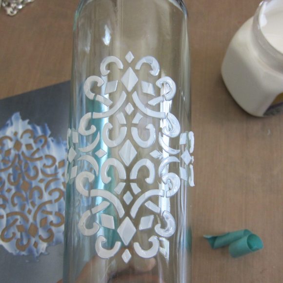 Make a Faux Sea Glass Bottle - Sea glass is still so popular, and it's a beautiful way to decorate your home in the summer.  Rather than buying new decorative accents, you can make your own using a few simple items plus recyclables.  