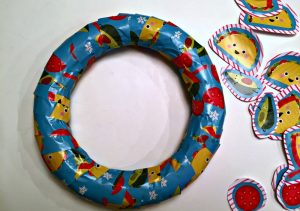 Recycled Gift Wrap wreath craft idea - Dollar Store Crafts