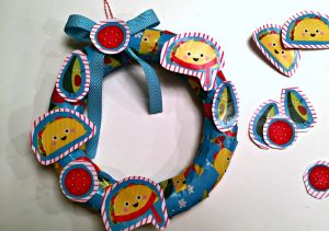 Wreath made out of recycled gift wrap - Dollar Store Crafts